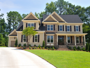 A beautiful home featuring earthy toned siding installed by Gateway Brothers Construction, your leading roofing contractor in High Ridge.